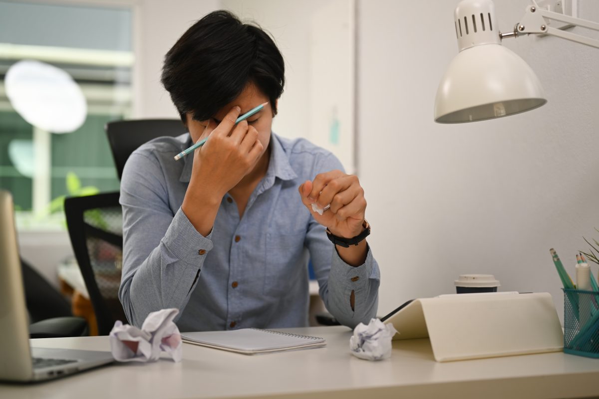Frustrated Businessman Massaging His Nose And Stressed After Pro