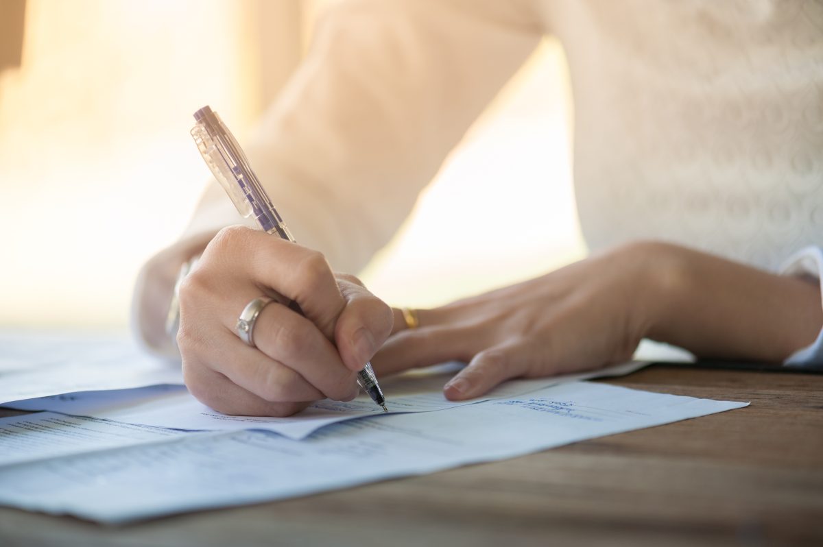 Woman Hand Writing On Paper