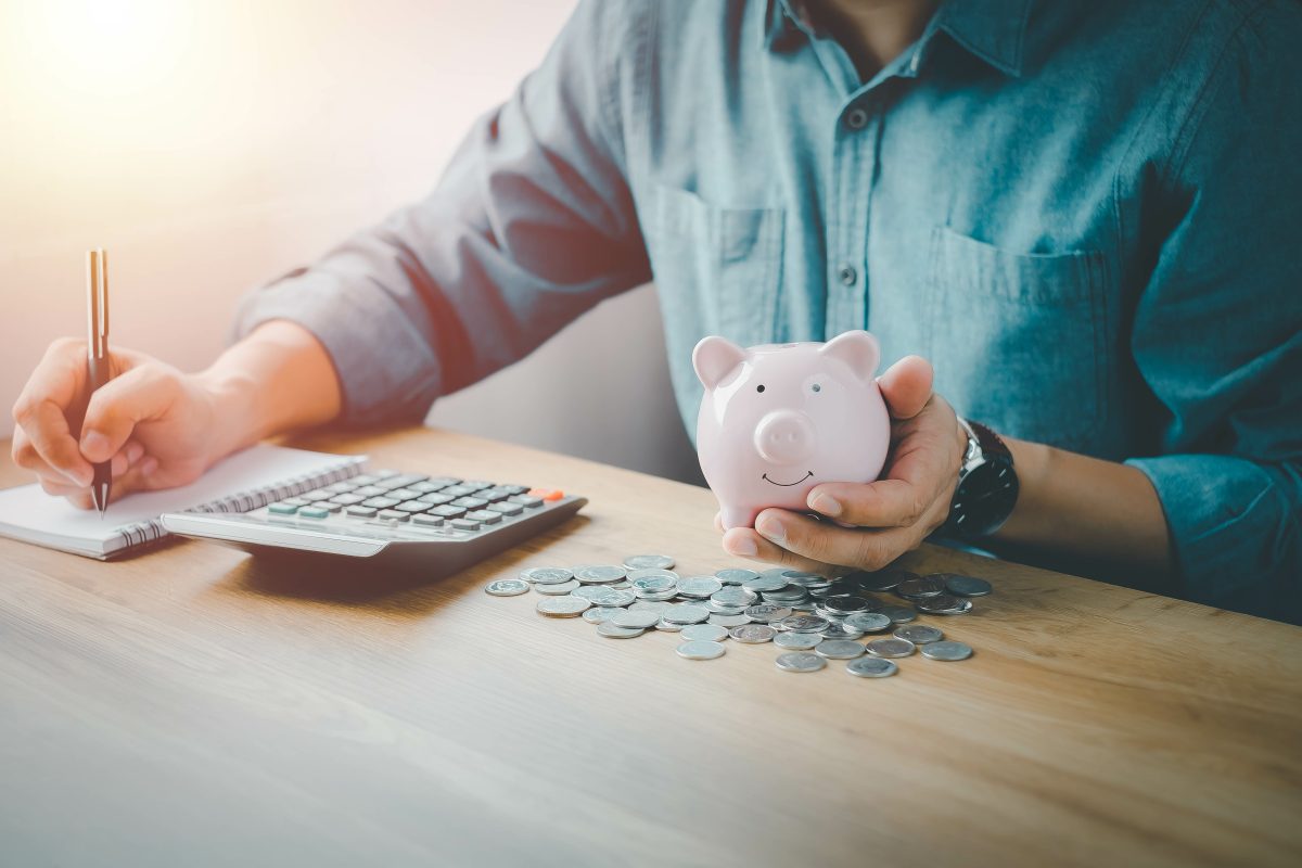 Piggy Bank On Hand For Account Save Money. Planning Step Up, Saving Money For Future Plan, Retirement Fund. Business Investment Finance Accounting Concept.