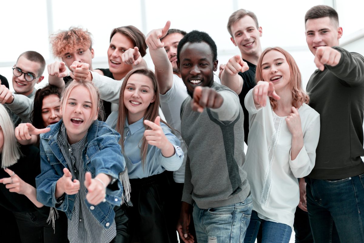 Group Of Cheerful Young People Pointing At You