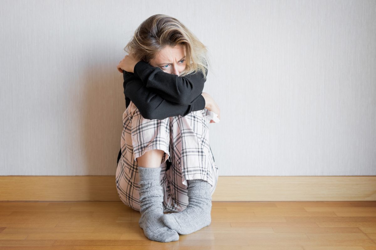 Sad Woman Sitting On Floor